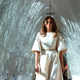 Former First Lady Melania Trump walks through the East Wing of the White House, which she decorated, during Christmas in 2017.